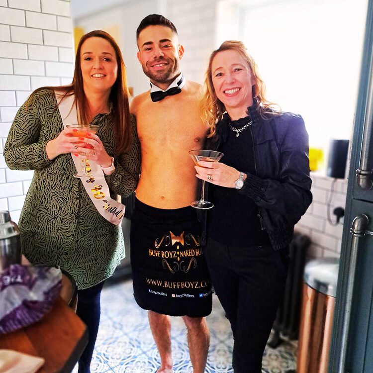 Buff butlers in Burnley talking with guests at an event