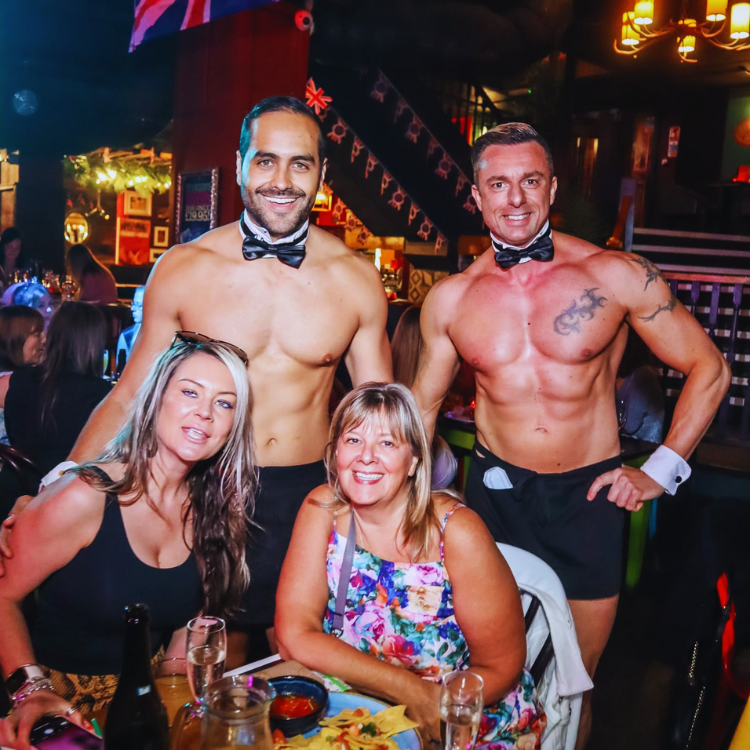 Butlers in the Buff in Scotland are captured providing service at a lively bottomless brunch at The Corinthian Club in Glasgow