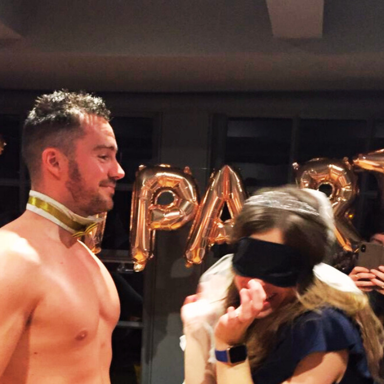 Buff butlers in the Bracknell area playing 'Find the Plaster' with a blindfolded guest at a hen party in an Airbnb house in Bracknell