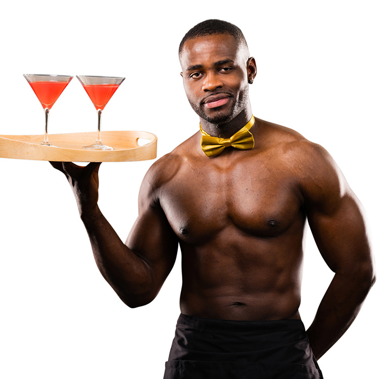 Naked butlers in Norwich holding a tray of cocktails at a Ladies Day event at the Knights Hill Hotel & Spa in Norfolk.