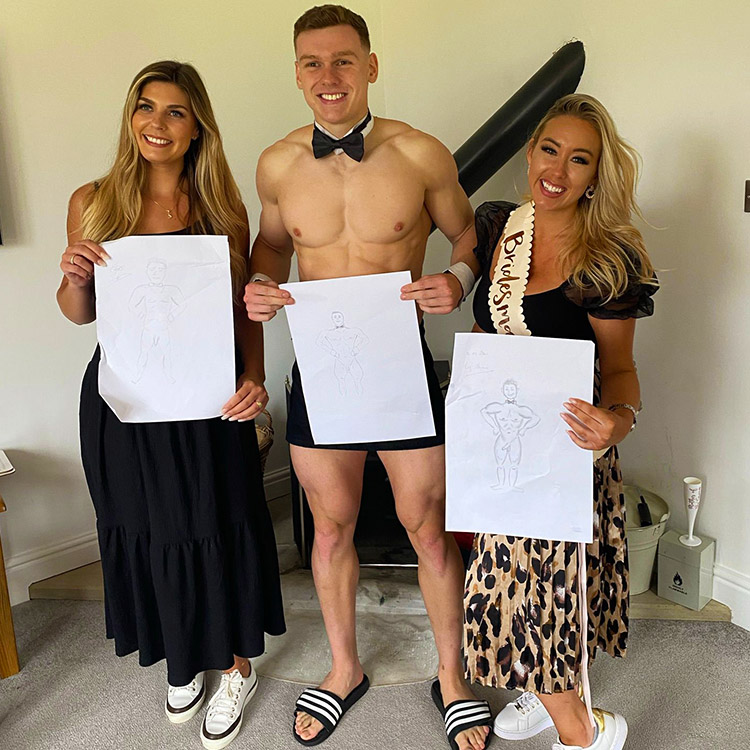 The bride-to-be and a friend proudly displaying their artwork alongside a life drawing model at a Hen Party Life Drawing in Hersham. Hen Party Life Drawing in Hersham near me