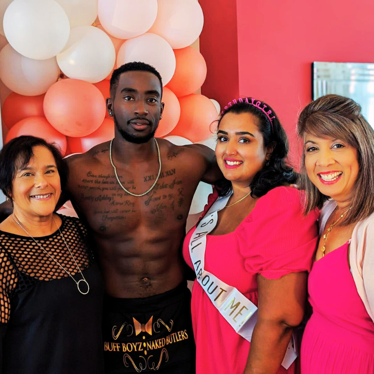 Naked butlers in aprons, collars, cuffs, and bowties posing with guests at a 30th birthday party anniversary celebration. Naked Butlers For Birthday Parties