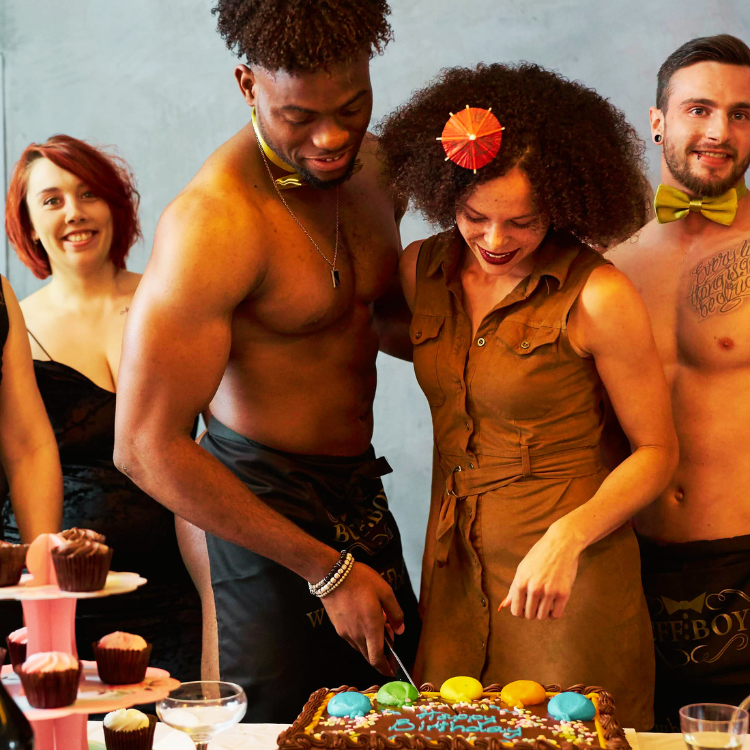 naked butlers in Camden at a 30th birthday event cutting a birthday cake with the birthday girl and two guests.