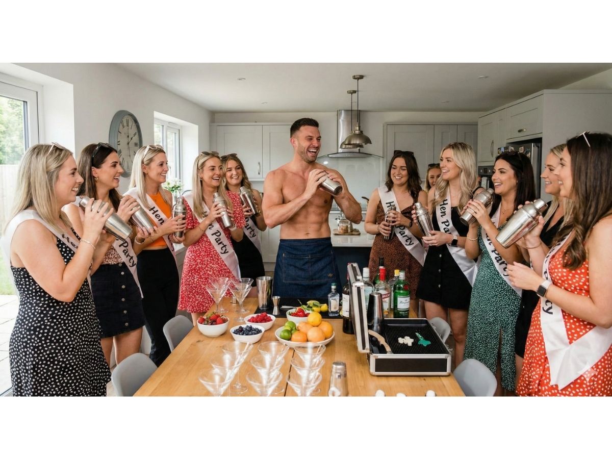 Buff butler hosting a hen party cocktail making class for a group in sashes around a kitchen table
