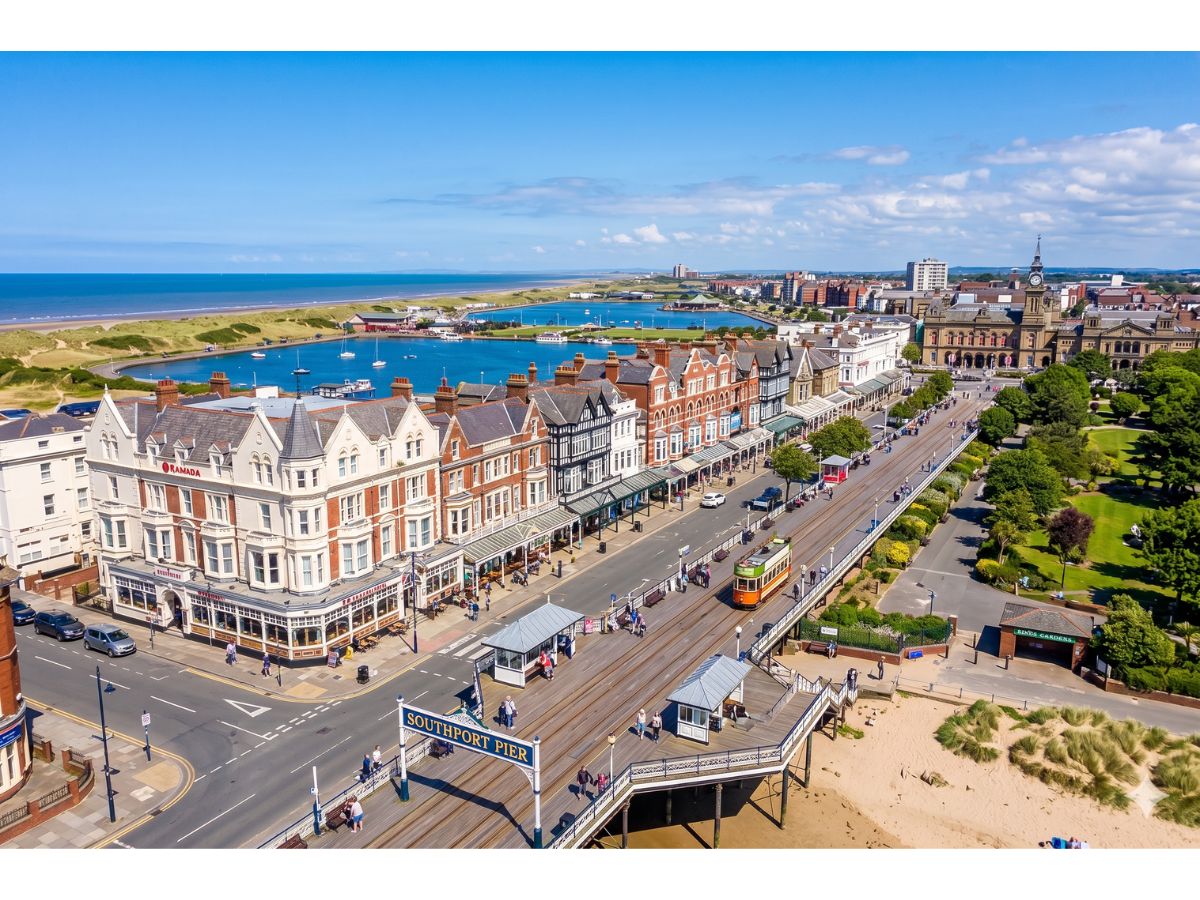 Aerial view of Southport seafront, Marine Lake and the Southport Pier entrance on a sunny day